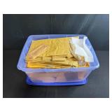 Collection of Padded Mailing Envelopes and Bubble Mailers in Storage Bin