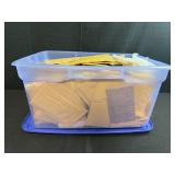 Collection of Padded Mailing Envelopes and Bubble Mailers in Storage Bin