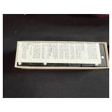 Vintage Game Collection with Domino Sets, Scrabble, and Chinese Checkers Marbles in Suitcase