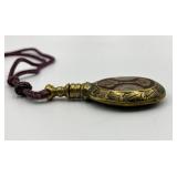 Ornate Brass Perfume Flask with Decorative Cord