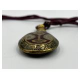 Ornate Brass Perfume Flask with Decorative Cord