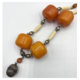 Large Butterscotch Amber Color Beads and Silver Bell Pendant