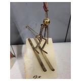 Pair of Signed Mid-Century Metal Sculptures Sailboat and Skier on Stone Base