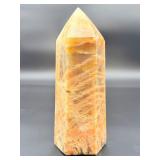 A large regular moonstone generator tower featuring a smooth, creamy sheen with gentle pearlescent glow.