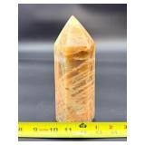 A large regular moonstone generator tower featuring a smooth, creamy sheen with gentle pearlescent glow.