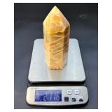 A large regular moonstone generator tower featuring a smooth, creamy sheen with gentle pearlescent glow.