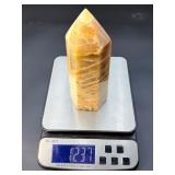 A large regular moonstone generator tower featuring a smooth, creamy sheen with gentle pearlescent glow.