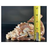 This Red Jasper dragon is a carved symbol of strength, courage, and grounding.