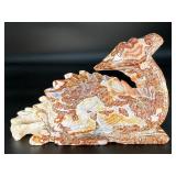 This Red Jasper dragon is a carved symbol of strength, courage, and grounding.
