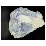 Blue Halite Crystal is a translucent cluster of soft blue cubic formations, exuding a calm, cooling energy.