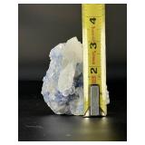 Blue Halite Crystal is a translucent cluster of soft blue cubic formations, exuding a calm, cooling energy.