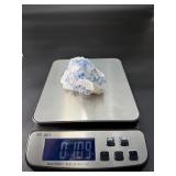 Blue Halite Crystal is a translucent cluster of soft blue cubic formations, exuding a calm, cooling energy.