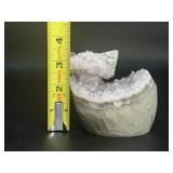 A stunning Amethyst crystal perched on its natural matrix, featuring delicate Calcite inclusions that add depth and character.