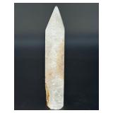 A delicate druzy Golden Healer quartz tower sparkling with a natural crust of tiny crystals atop warm golden tones. Slender and radiant, it amplifies healing, light.