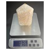 A delicate druzy Golden Healer quartz tower sparkling with a natural crust of tiny crystals atop warm golden tones. Slender and radiant, it amplifies healing, light.