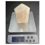 A delicate druzy Golden Healer quartz tower sparkling with a natural crust of tiny crystals atop warm golden tones. Slender and radiant, it amplifies healing, light.