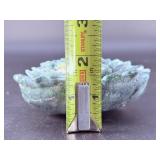 A hand-carved flower crafted from natural moss agate, showcasing intricate petal details and the stone’s unique green and earthy inclusions.