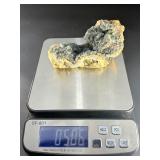 A striking specimen of large blue fluorite perched atop a clear quartz crystal matrix.