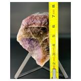 A vibrant Super 7 slice showcasing the unique combination of seven powerful minerals—amethyst, cacoxenite, goethite, lepidocrocite, rutile, smoky quartz, and clear quartz.