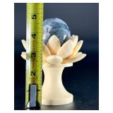 A serene moss agate collection featuring two hand-carved leaf-shaped pieces and a polished sphere with a druzy center resting on a lotus stand.