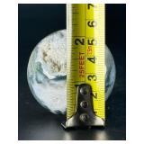 A serene moss agate collection featuring two hand-carved leaf-shaped pieces and a polished sphere with a druzy center resting on a lotus stand.