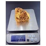 A delicate carbonate mineral of zinc and copper, displaying soft hues of pale blue to green‑blue in fine acicular (needle‑like) crystal sprays or tufted clusters.