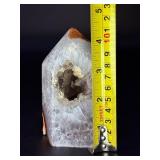 An Agate Druzy Tower is a striking crystal piece that blends the grounding beauty of agate with the sparkling magic of natural druzy formations.