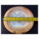 Agate dish is a beautifully polished, hand-carved piece that highlights the natural banding and rich earthy tones of agate.