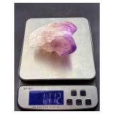 An Elestial Amethyst Cluster is a rare and powerful crystal formation celebrated for its intricate, layered growth and deep spiritual energy.