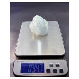 A Blue Raw Fluorite piece showcases the crystal in its natural, unpolished state, highlighting its geometric formations and soft to vibrant blue hues.