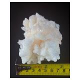 Peach Stilbite is a delicate and captivating crystal known for its soft, peachy-pink color and intricate, fan-like formations. Often found in clusters, the crystal’s radiating, layered structures ca