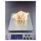 Peach Stilbite is a delicate and captivating crystal known for its soft, peachy-pink color and intricate, fan-like formations. Often found in clusters, the crystal’s radiating, layered structures ca