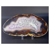 Banded Amethyst Agate (Polished) is a stunning crystal piece that combines the deep, rich purples of amethyst with the layered, earthy tones of agate.