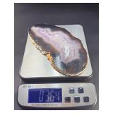 Banded Amethyst Agate (Polished) is a stunning crystal piece that combines the deep, rich purples of amethyst with the layered, earthy tones of agate.