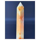 Carnelian Flower Agate Tower is a stunning hand-carved crystal that combines the vibrant, energizing hues of carnelian with the earthy, patterned beauty of flower agate.