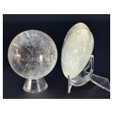 Quartz Sphere and Quartz Heart with Inclusions are captivating crystal pieces that showcase the natural beauty and energetic depth of quartz.