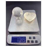 Quartz Sphere and Quartz Heart with Inclusions are captivating crystal pieces that showcase the natural beauty and energetic depth of quartz.