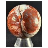 Laguna Lace Agate Sphere is a mesmerizing crystal sphere that highlights the intricate, lace-like banding unique to Laguna Agate.