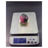 Ruby Zoisite is a striking natural stone that beautifully blends vibrant ruby inclusions with earthy green zoisite, often accented by dark hornblende veins.