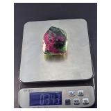 Ruby Zoisite is a striking natural stone that beautifully blends vibrant ruby inclusions with earthy green zoisite, often accented by dark hornblende veins.