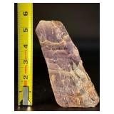 Raw Chevron Amethyst showcases the stone in its natural, unpolished form, highlighting bold V-shaped bands of deep purple amethyst and milky white quartz.