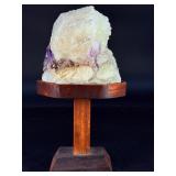 Amethyst Geode with Calcite is a stunning natural formation that combines sparkling amethyst crystals with contrasting calcite inclusions.