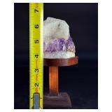 Amethyst Geode with Calcite is a stunning natural formation that combines sparkling amethyst crystals with contrasting calcite inclusions.