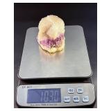 Amethyst Geode with Calcite is a stunning natural formation that combines sparkling amethyst crystals with contrasting calcite inclusions.