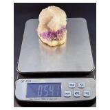 Amethyst Geode with Calcite is a stunning natural formation that combines sparkling amethyst crystals with contrasting calcite inclusions.
