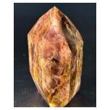 Super 7 Tower is a powerful and highly sought-after crystal carved into a polished towerthat showcases the natural blend of seven minerals: amethyst, clear quartz, smokyquartz, rutile, goethite, lepid