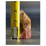 Super 7 Tower is a powerful and highly sought-after crystal carved into a polished towerthat showcases the natural blend of seven minerals: amethyst, clear quartz, smokyquartz, rutile, goethite, lepid