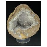 Natural Quartz Agate “Galaxy” Geode is a mesmerizing geological treasure that resembles a miniature cosmic landscape.