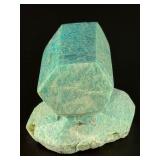 Amazonite Hand-Carved Chunk is a beautifully sculpted crystal piece that highlights the soothing blue-green tones and natural striations of amazonite.