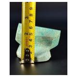 Amazonite Hand-Carved Chunk is a beautifully sculpted crystal piece that highlights the soothing blue-green tones and natural striations of amazonite.